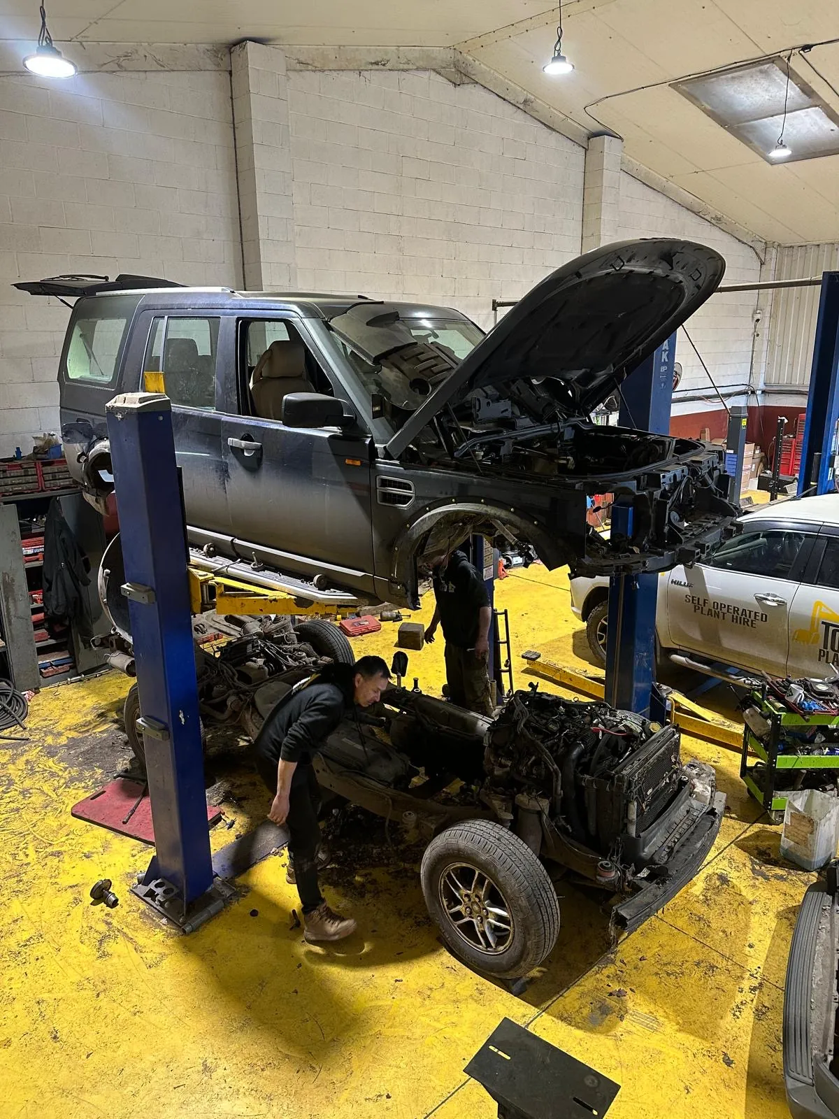 Vehicle undergoing substantial mechanical repair at Top Plant Garage